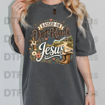 Western Christian Heat Transfer Raised on Dirt Roads and Jesus DTF Transfer Ready to Press Country Western Cowboy Boots Cross Tee